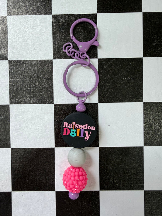 RAISED ON DOLLY KEYCHAIN