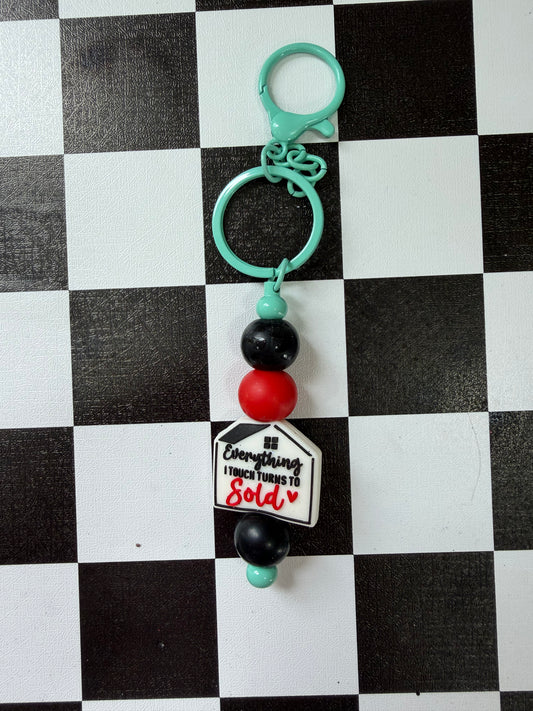 EVERYTHING I TOUCH TURNS TO SOLD KEYCHAIN